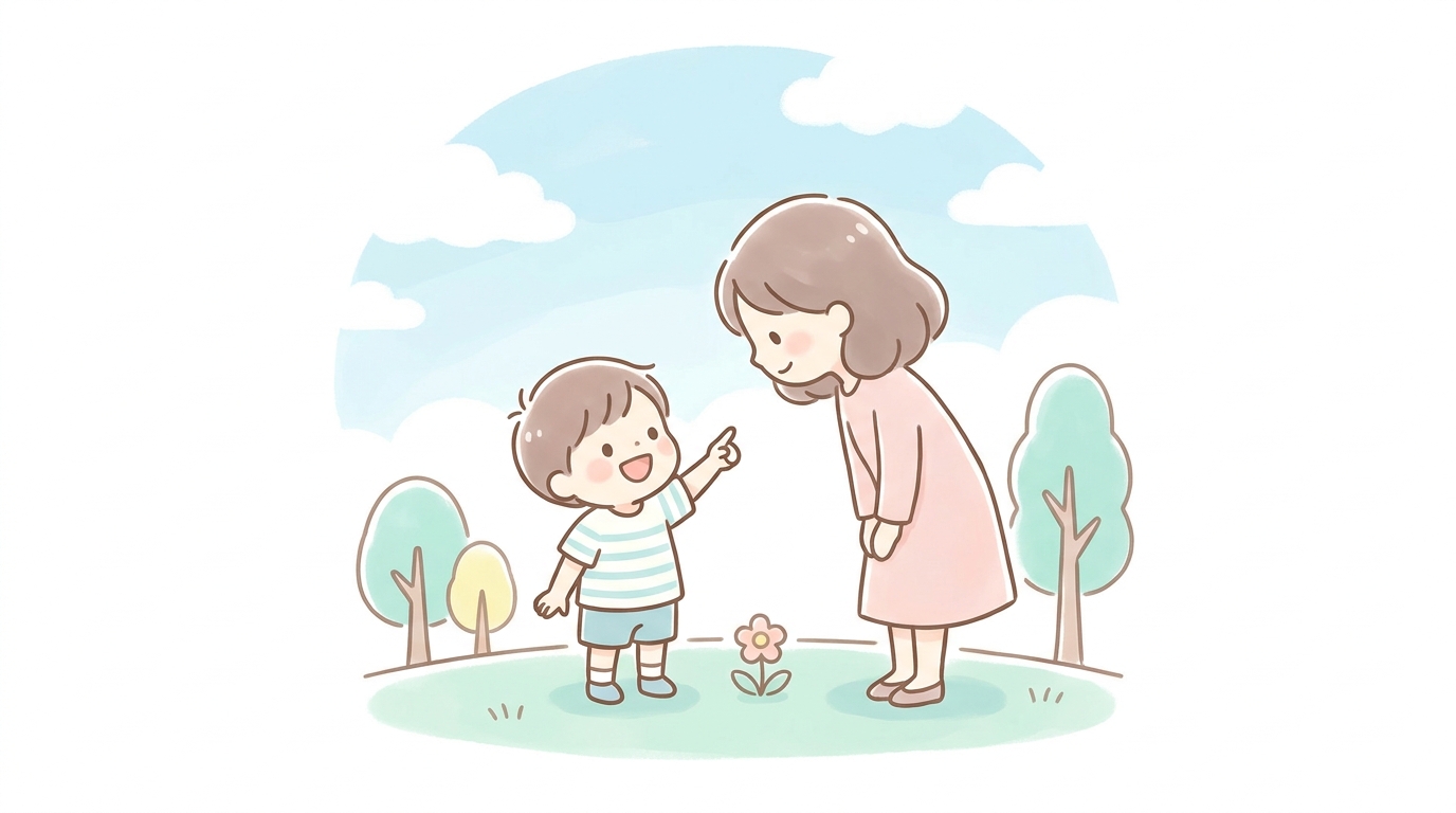 公園で青空を指差して大人に何かを話しかける3歳の男の子の笑顔