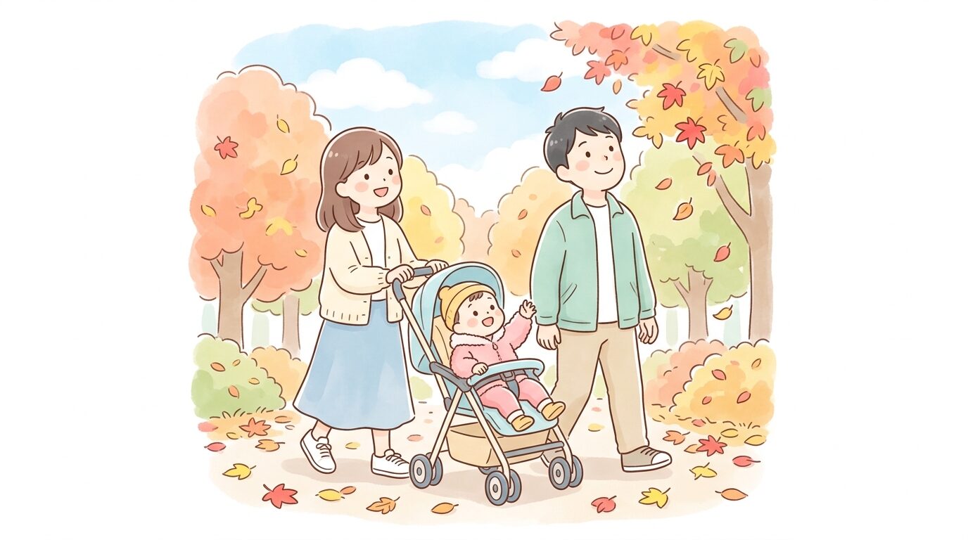 紅葉の公園でベビーカーを押しながら赤や黄色の落ち葉を見上げる若い夫婦と1歳児