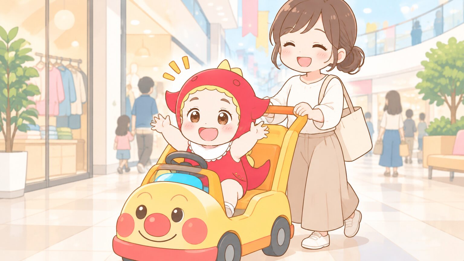 アンパンマンのキャラクターカートに乗って嬉しそうに笑う1歳半くらいの男の子と、後ろから優しく押すママ、明るいショッピングモールの通路